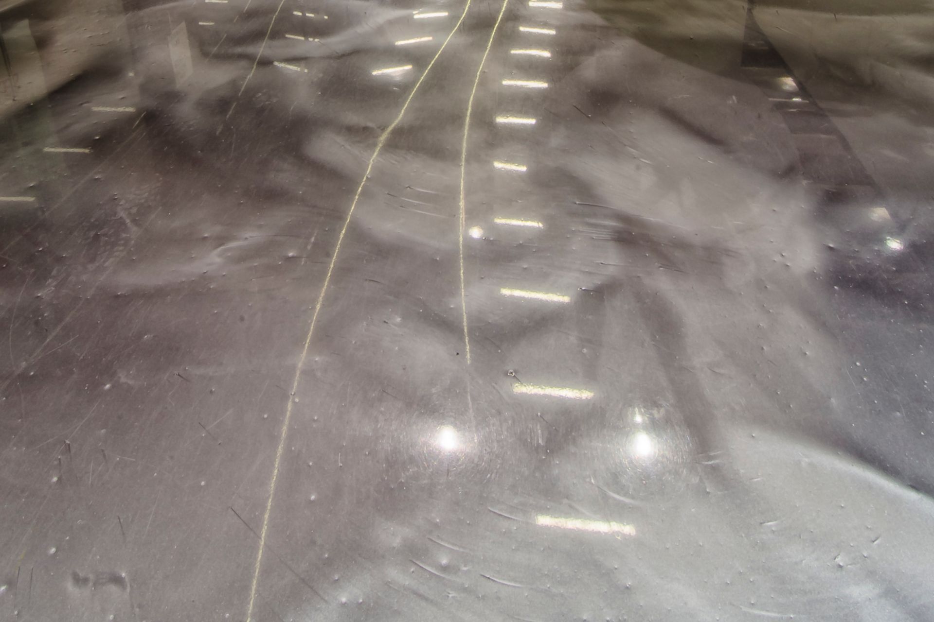 White plant vase on metallic floor in DFO Homebush shopping center