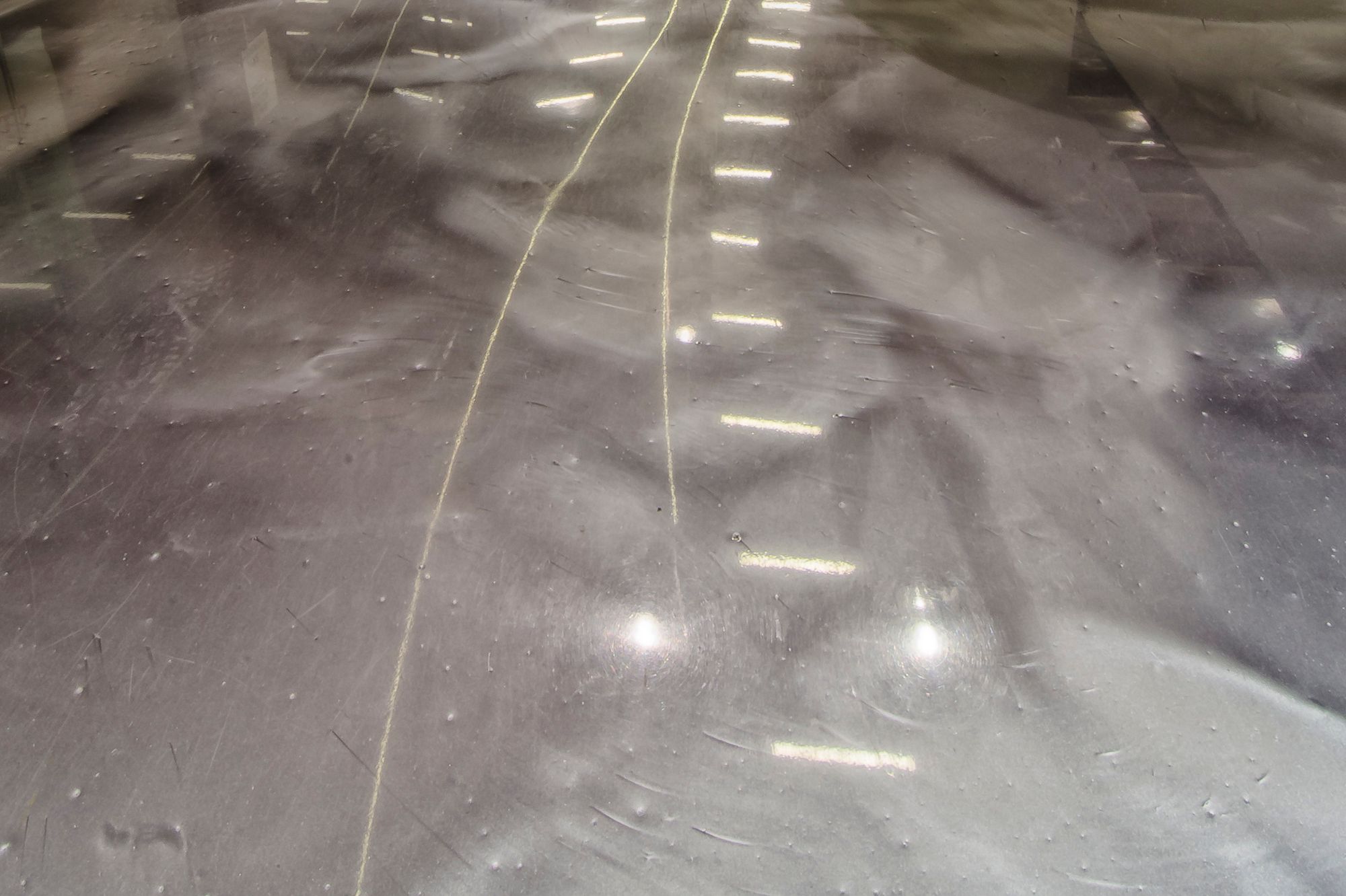 White plant vase on metallic floor in DFO Homebush shopping center