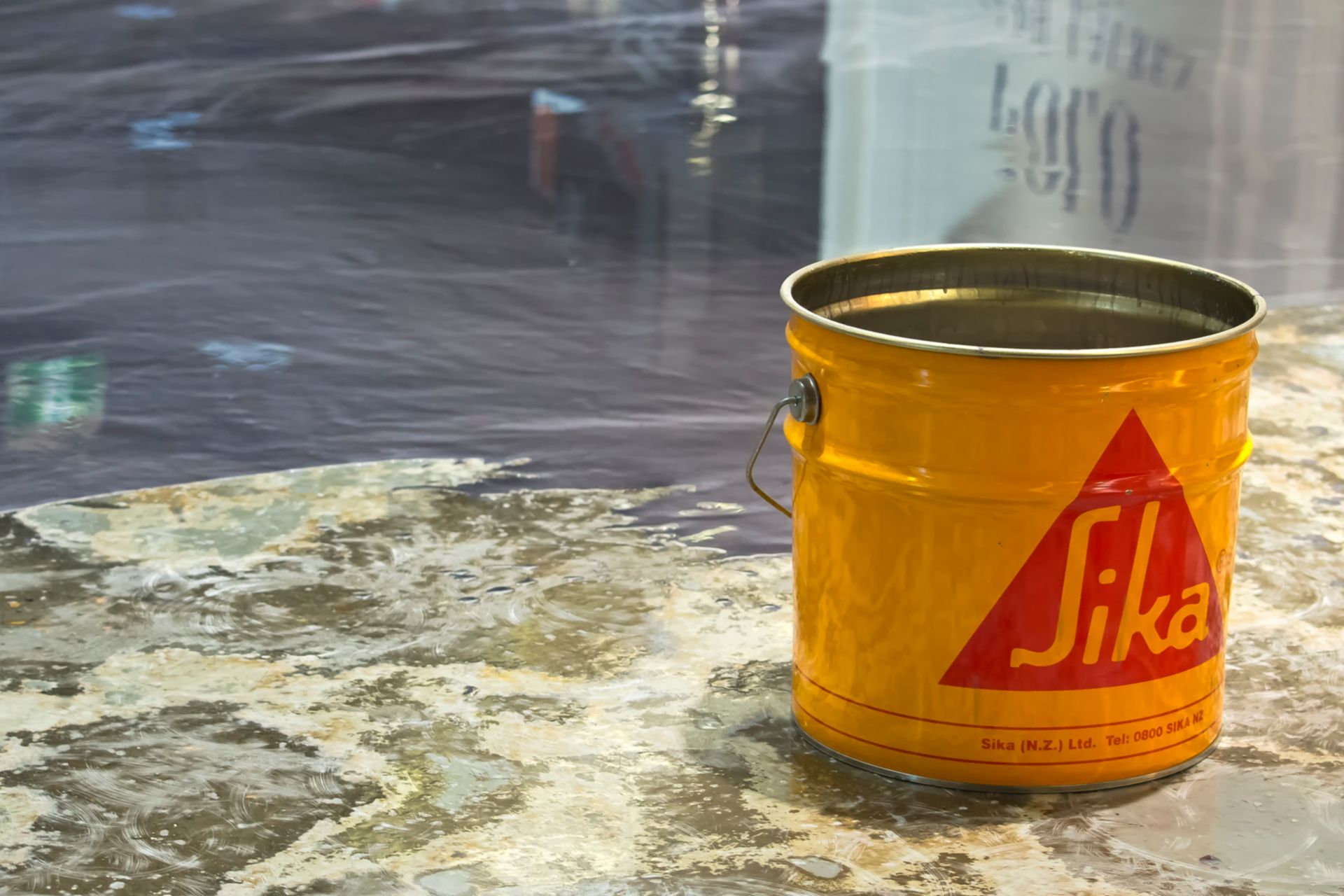 Yellow bucket with Sikafloor and metallic effect floor