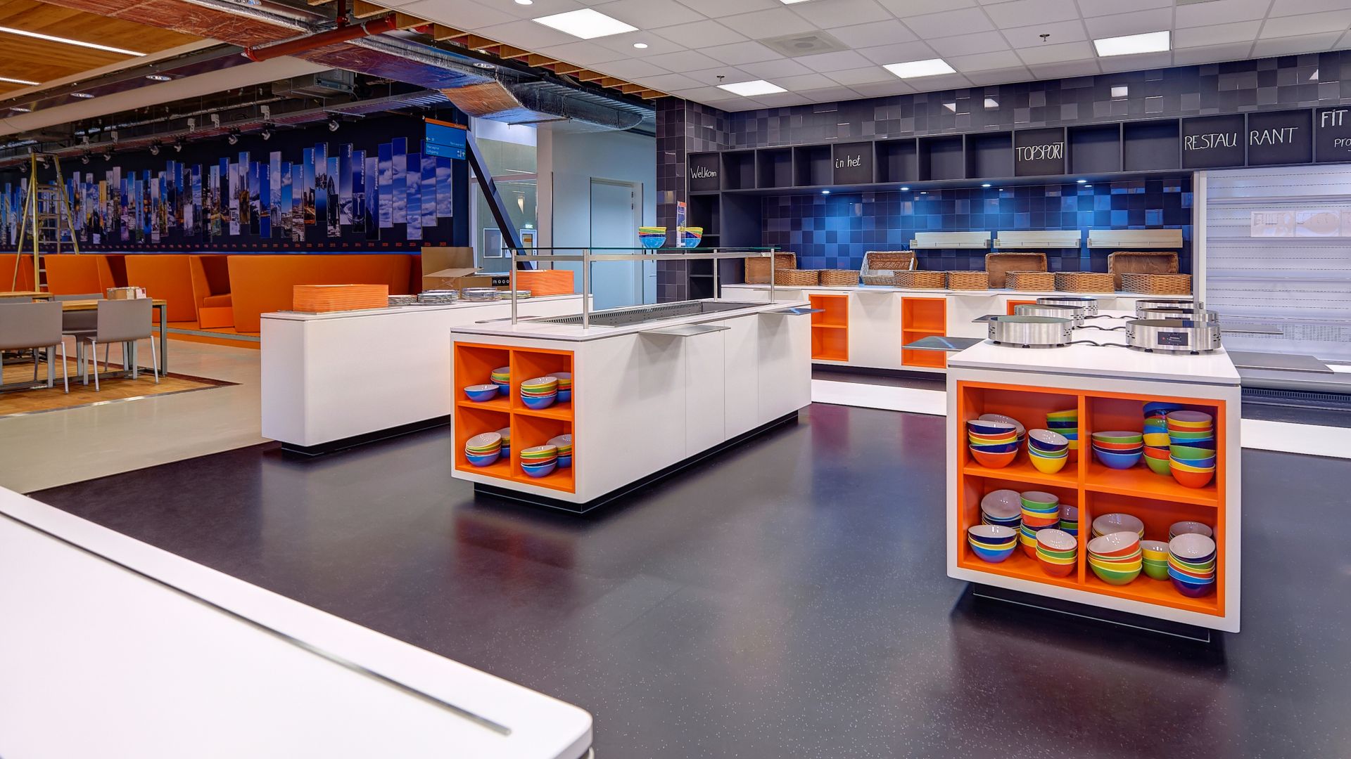 Sales room kitchen restaurant showcase with decorative floor and orange shelves with bowls