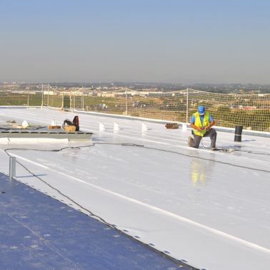 Man working on the roof Fruit Packaging House of Frutinter Company