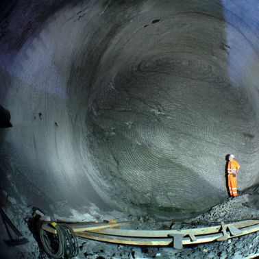 Construction worker standing  inside Gotthard Tunnel in Switzerland