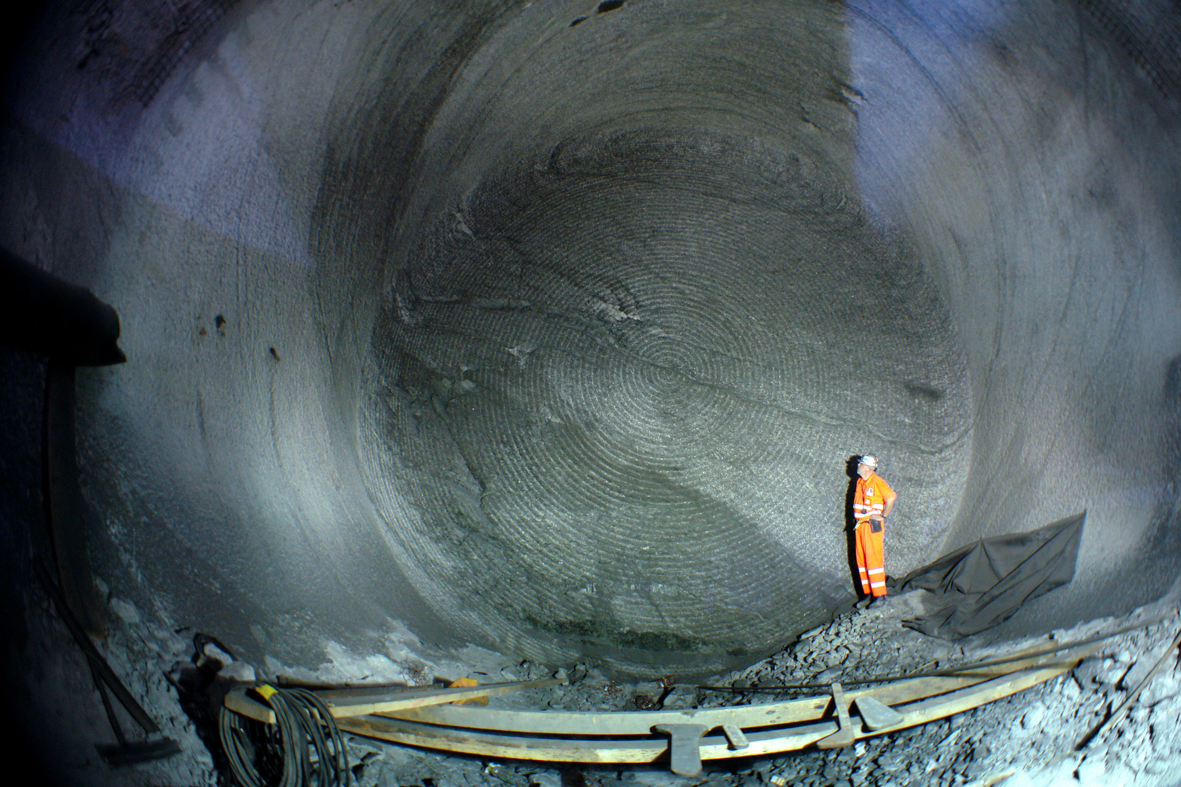 Construction worker standing  inside Gotthard Tunnel in Switzerland