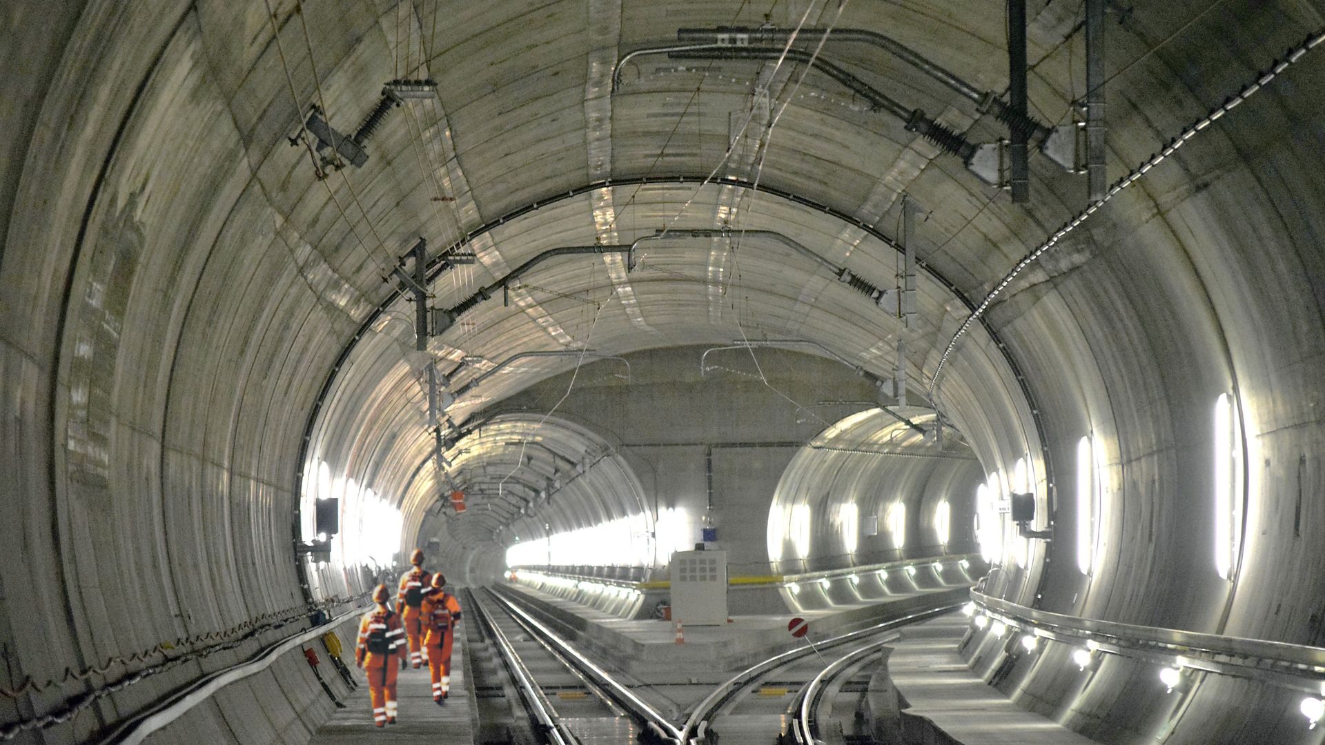 Construction workers walking inside Gotthard Tunnel in Switzerland