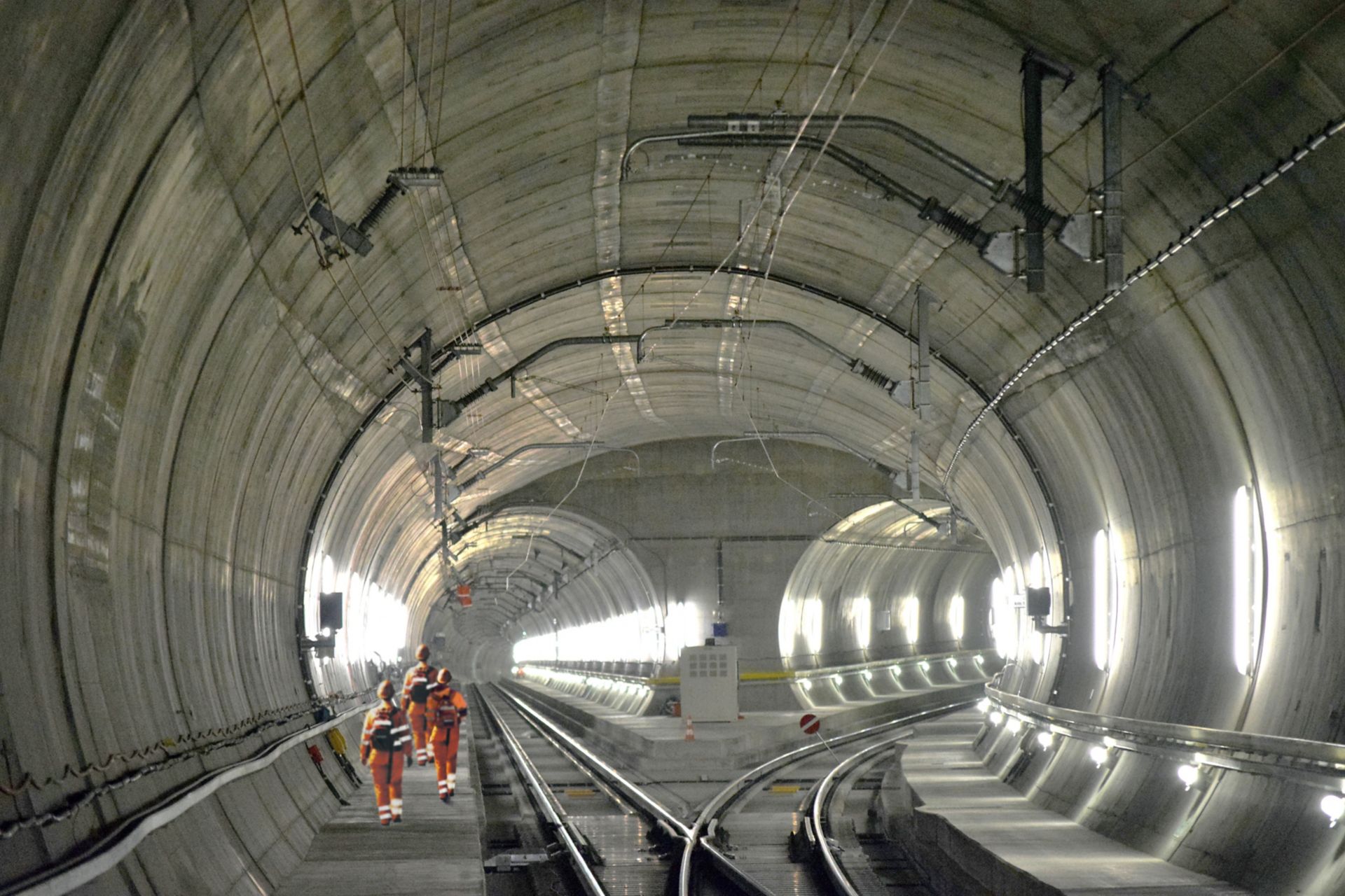 Construction workers walking inside Gotthard Tunnel in Switzerland