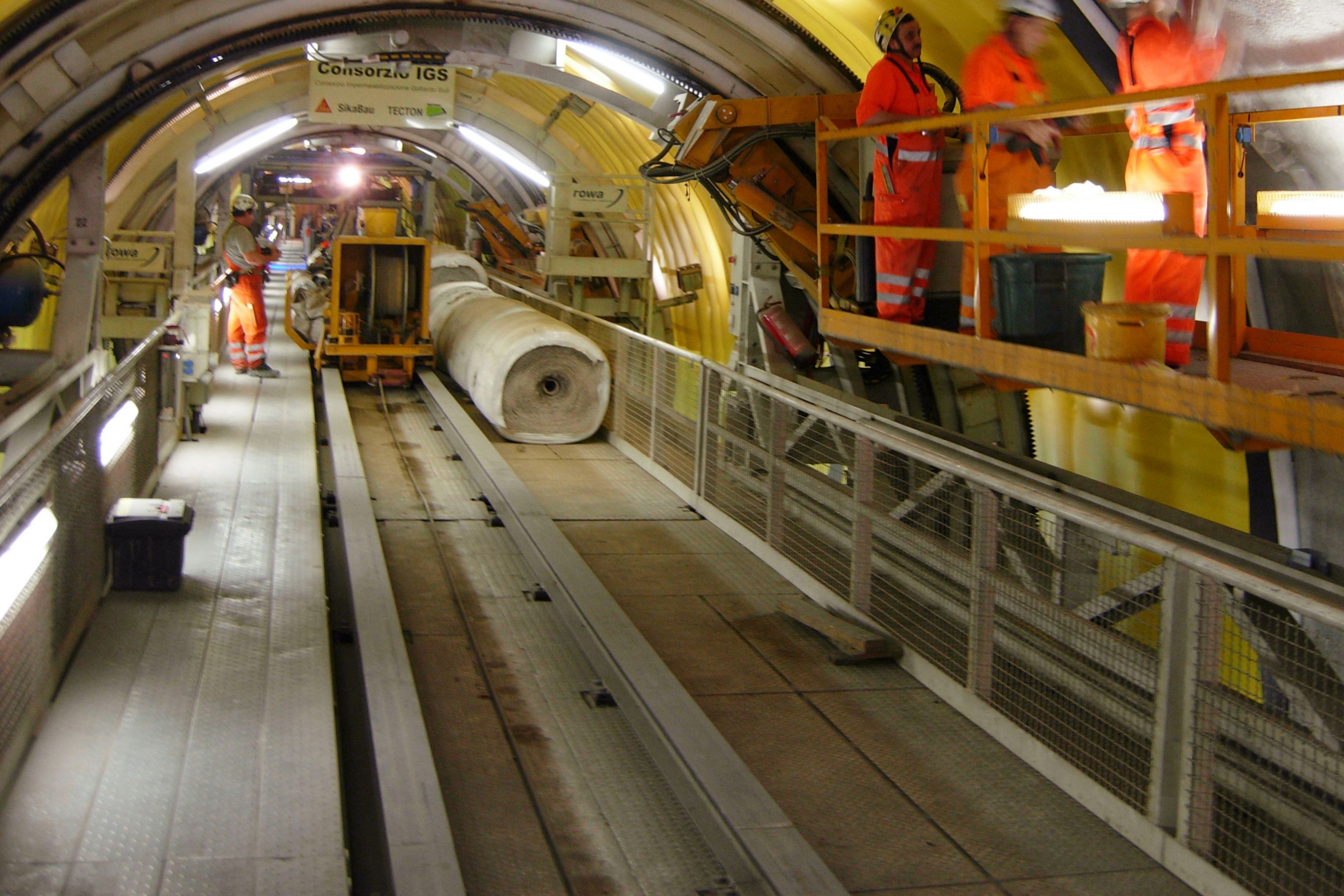 Construction workers waterproofing Gotthard Tunnel in Switzerland with Sikaplan membranes