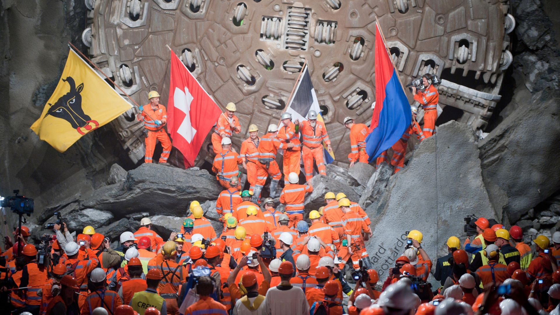 Workers celebrating the tunnel breakthrough in Gotthard Base Tunnel