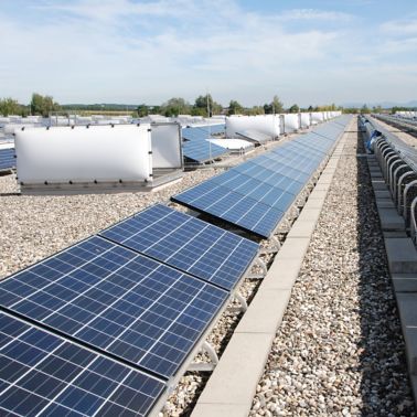 Solar panels on gravel ballasted roof with single ply membranes