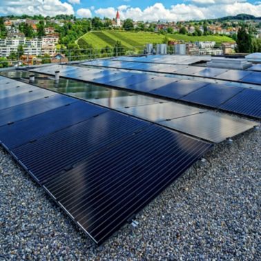 Solar panels on gravel ballasted roof with single ply membranes