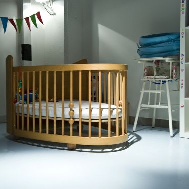 Sika ComfortFloor® grey floor in baby room with crib