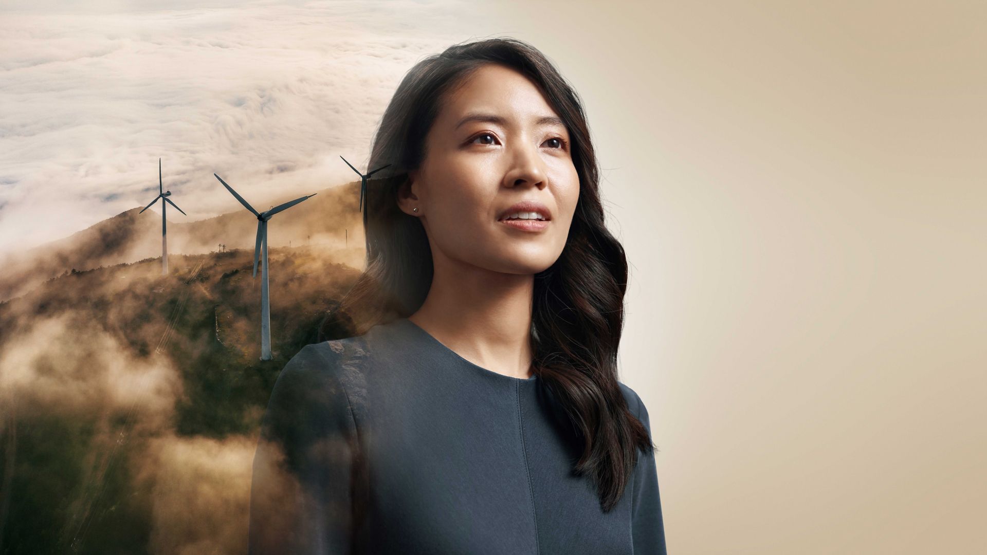 Woman with wind turbines in the background