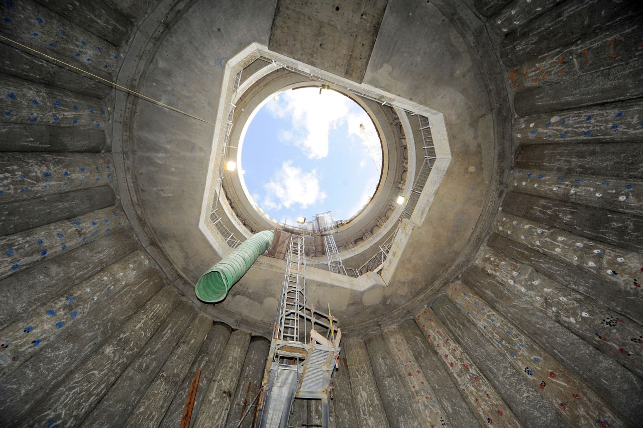 View inside silo containment structure looking up at sky
