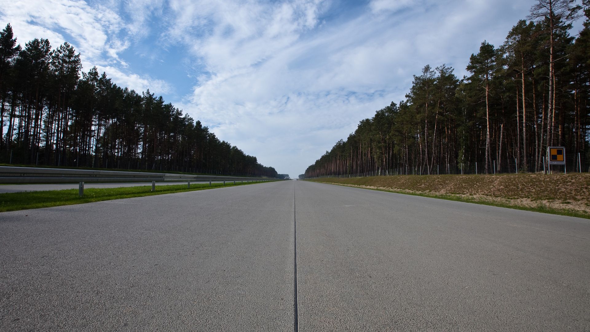 Highway road joint in Poland with trees forest