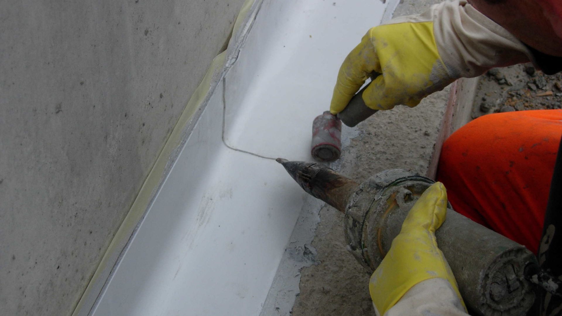 Sikadur Combiflex waterproofing tape being applied with hot air welder at concrete joint in Glattbrugg, Switzerland