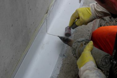 Sikadur Combiflex waterproofing tape being applied with hot air welder at concrete joint in Glattbrugg, Switzerland