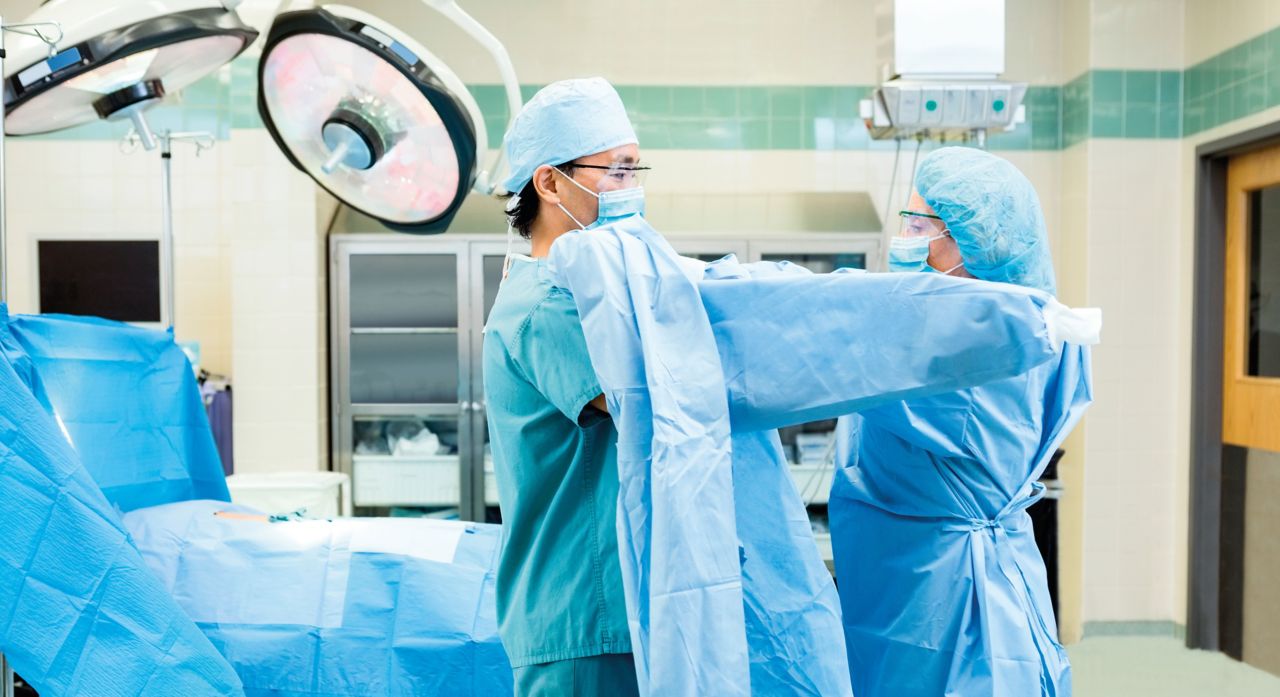 People in surgical theatre using blue medical technical textile garments