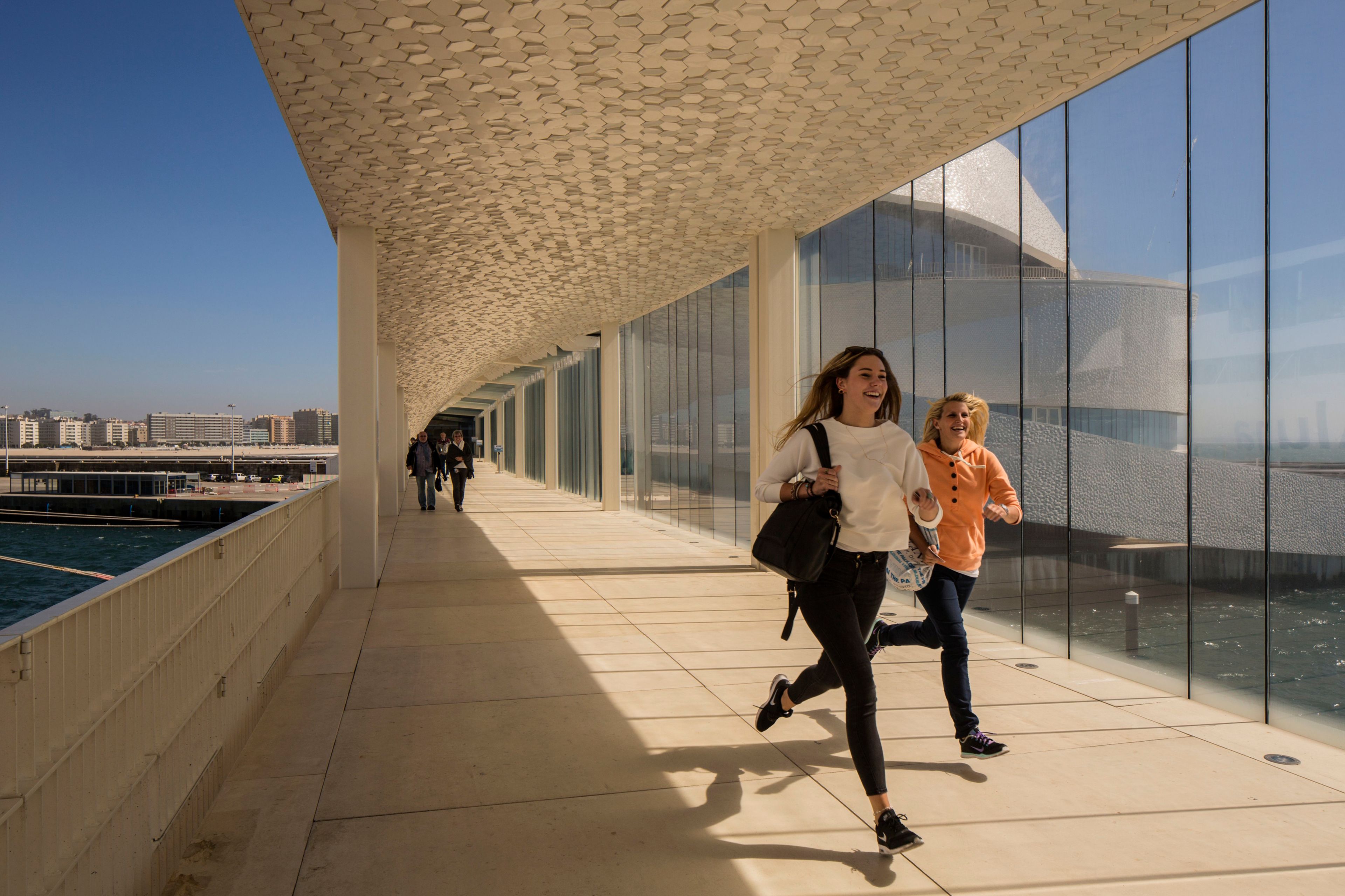 Two girls running at Leixoes Cruise Terminal in Porto Portugal