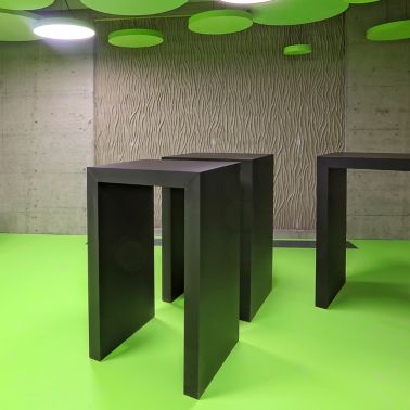 Green floor and architectural concrete wall in a kitchen