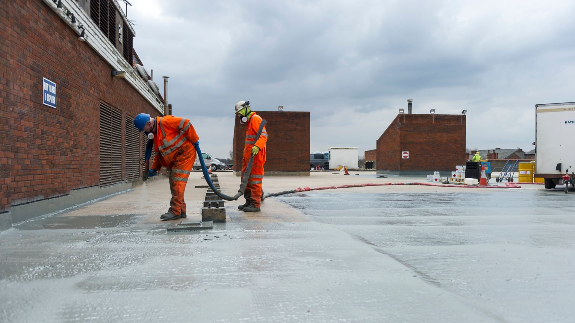 2 men applying Liquid Membrane