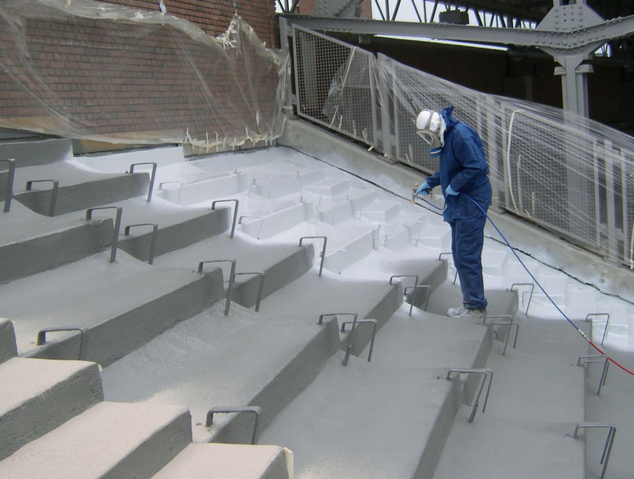 Man applying liquid membrane