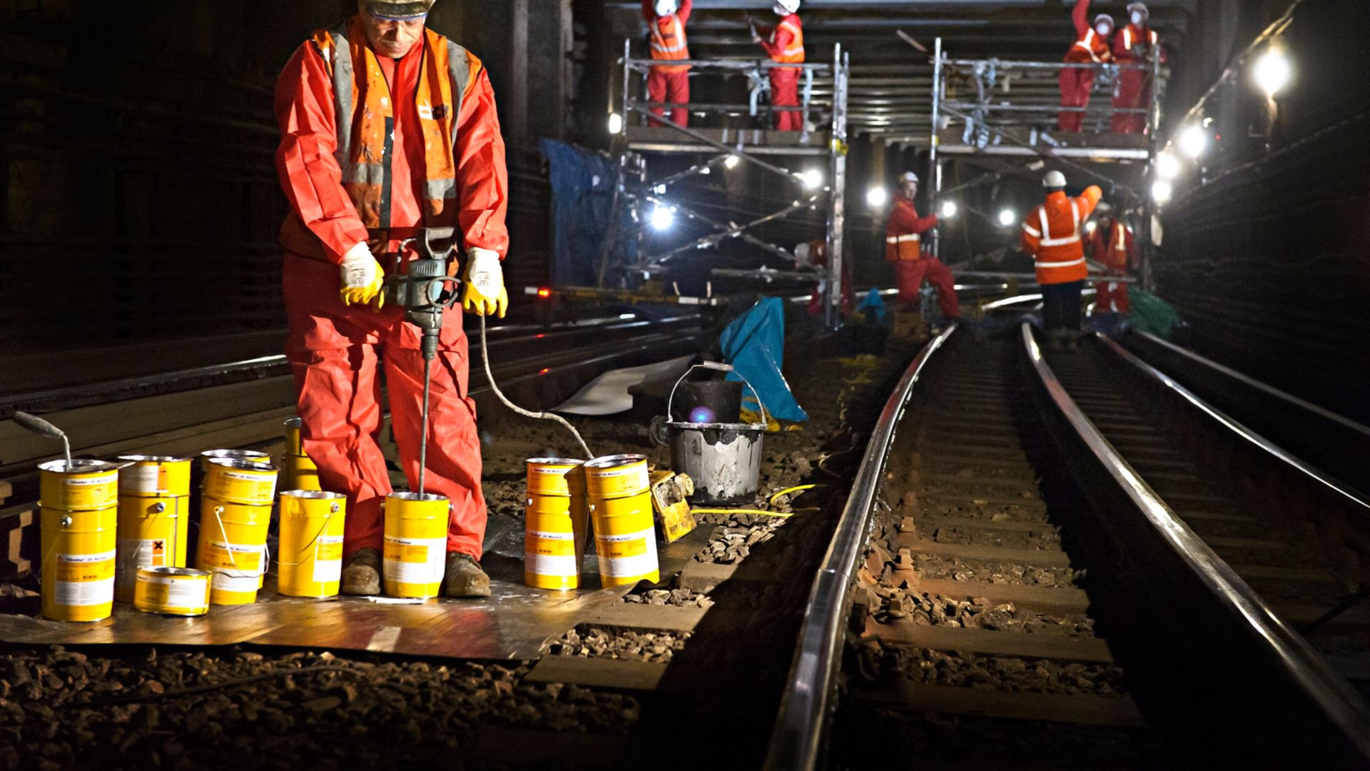 Construction worker with Sika products in London underground tunnel