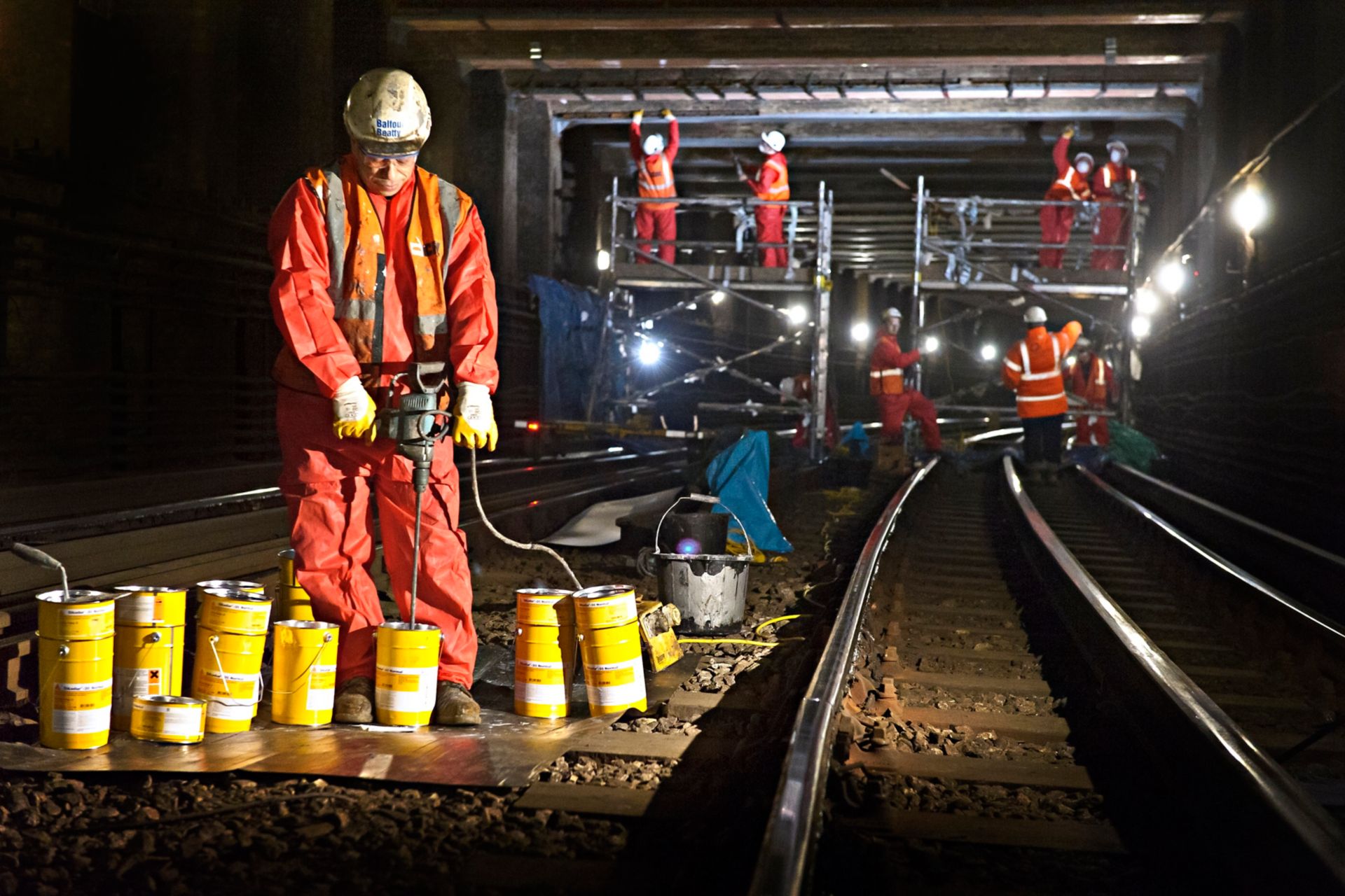 Construction worker with Sika products in London underground tunnel