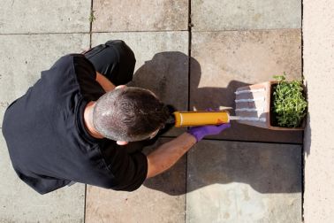 Man Applying Construction Adhesive