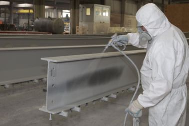   Man Applying Fire Resistant Coating on a  load-bearing structure	 