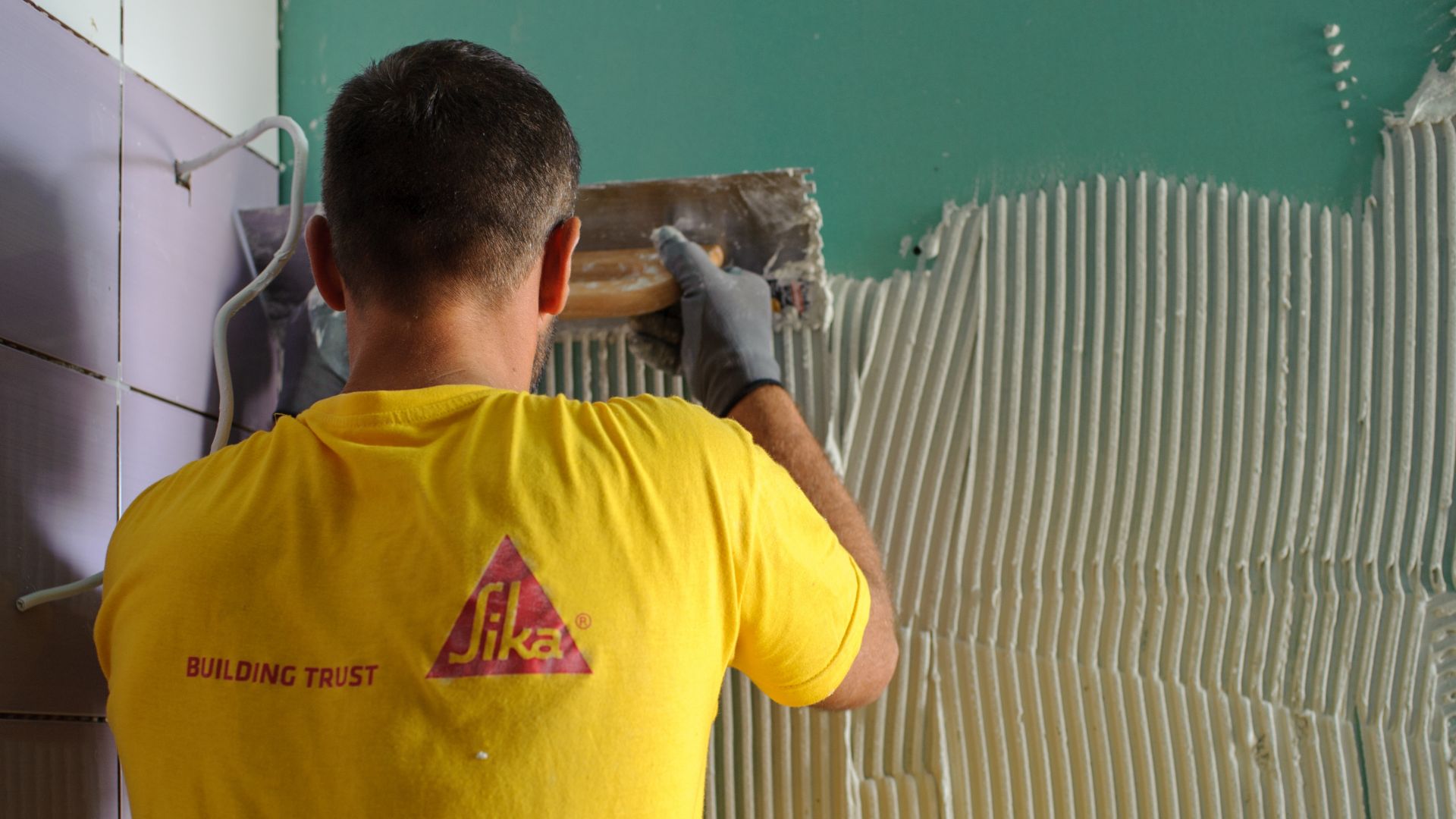 Man tiling at the Epirus Sport and Health Center in Ioannina, Greece