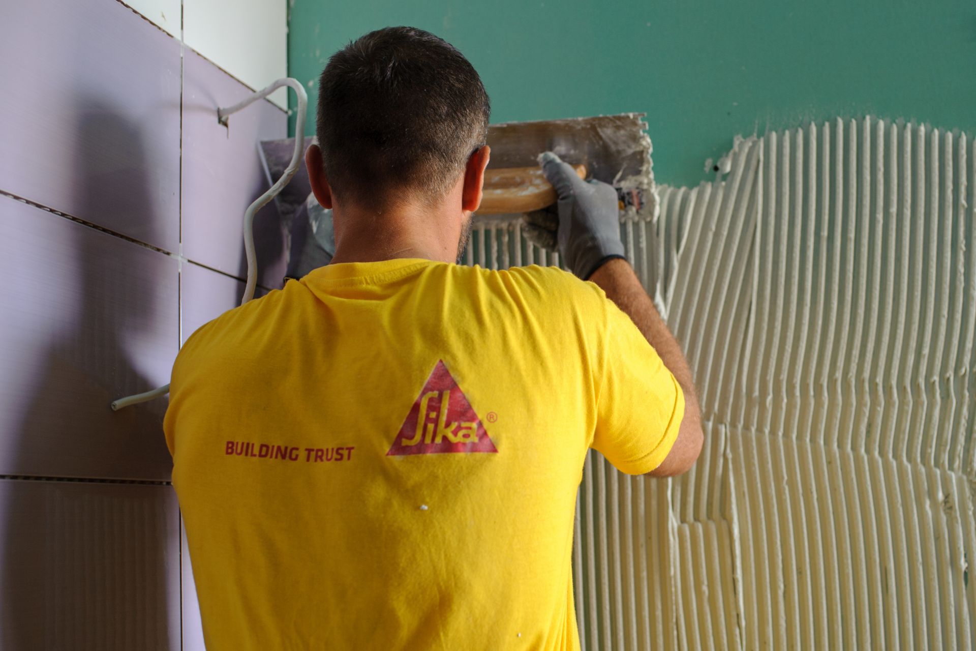 Man tiling at the Epirus Sport and Health Center in Ioannina, Greece