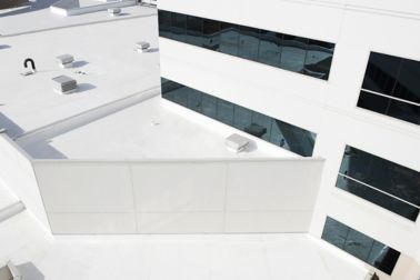 Cool roof with singly-ply PVC membrane of Sarnafil adhered system installed on St. John’s Regional Medical Center in Oxnard in USA