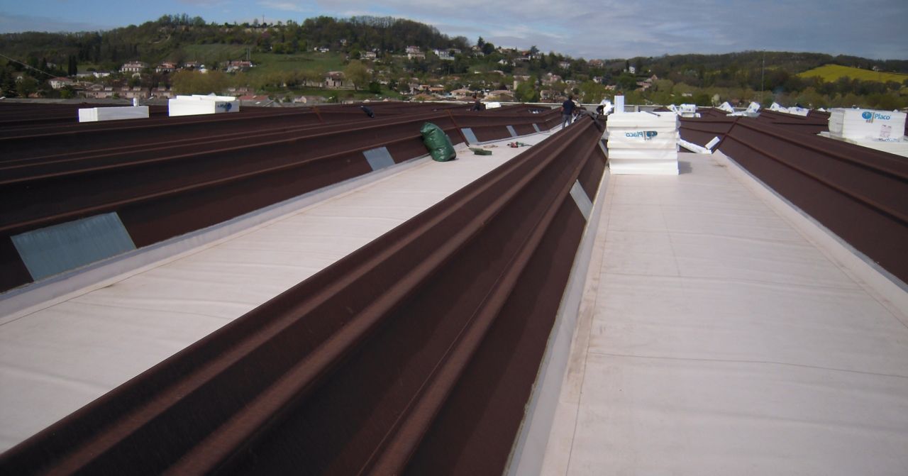 Metal roof after renovation repair with single ply roof membrane