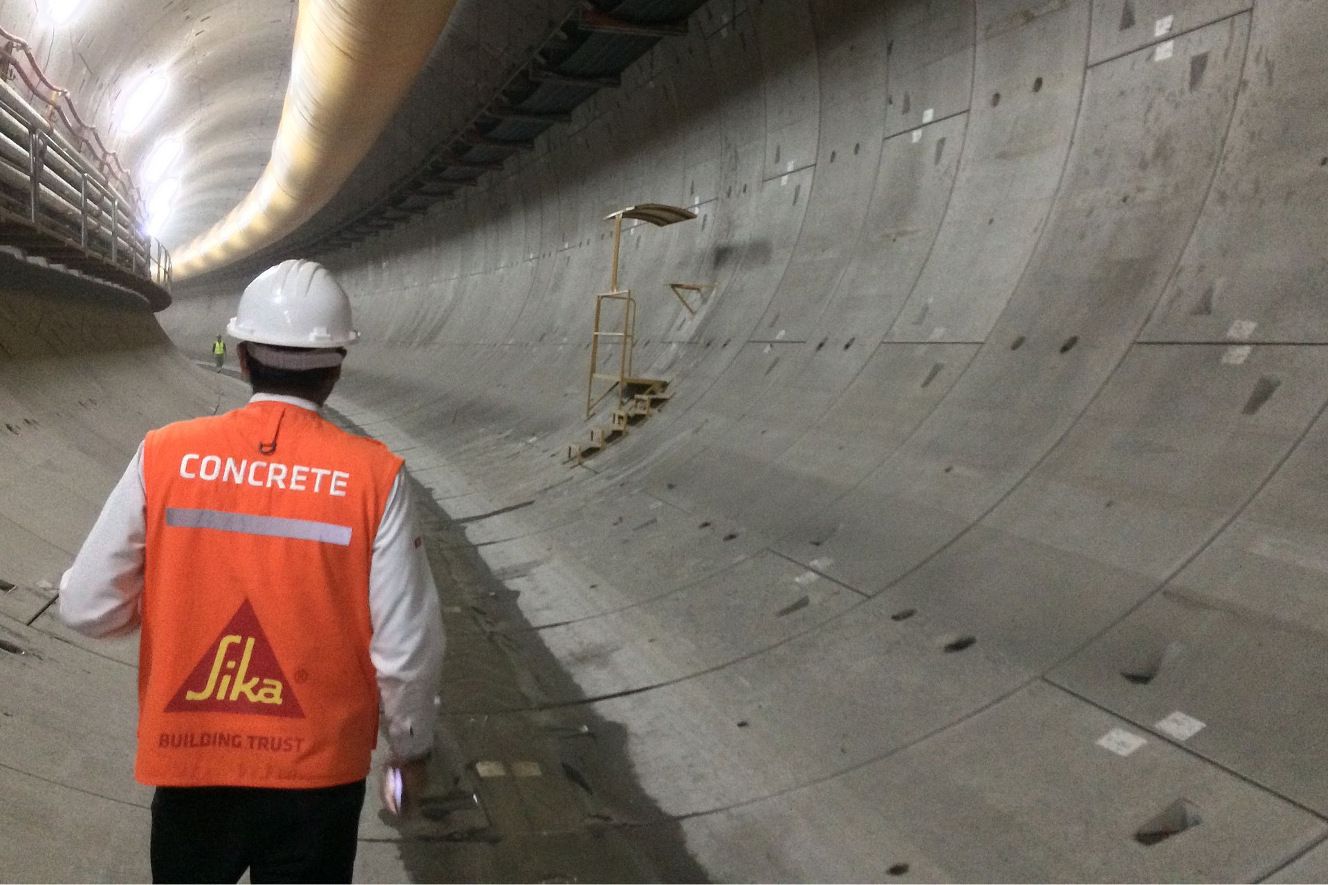 Engineer walking in the metro tunnel of Quito, Ecuador