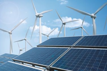 PV photovoltaic panels and wind turbines with blue sky