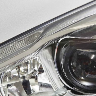 Close up view of vehicle headlamp bonded with Sika Exterior Adhesive Solutions