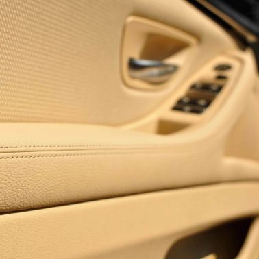 Close up interior view of vehicle door using Sika SikaMelt lamination adhesive solutions
