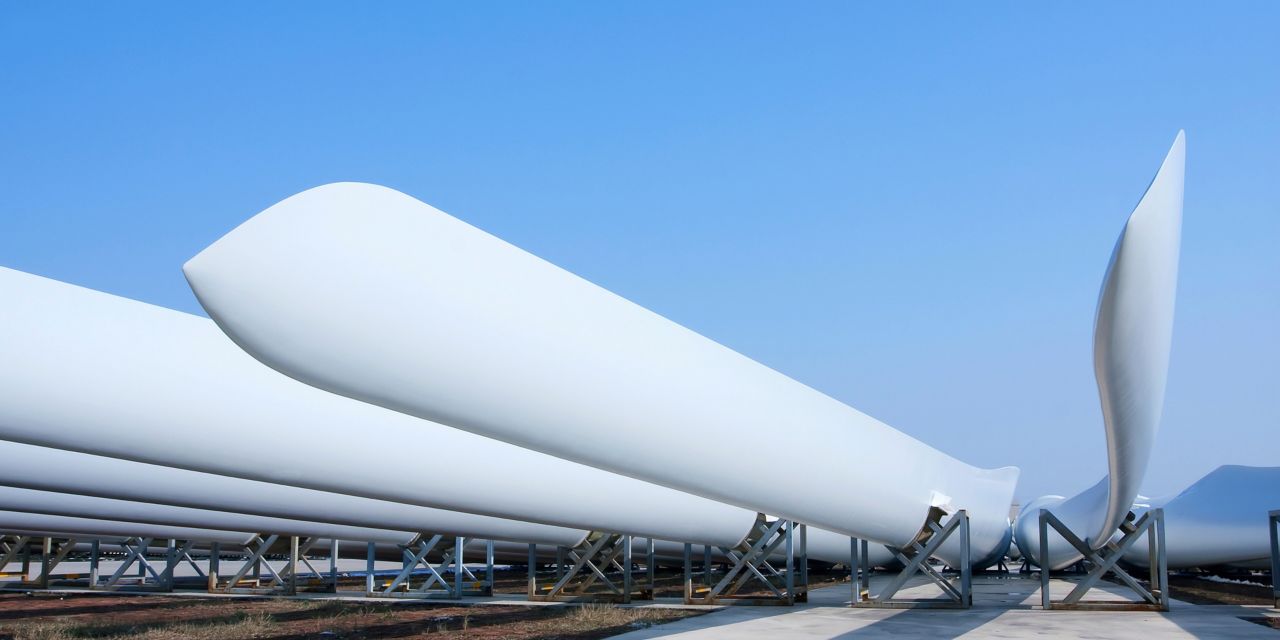 Wind turbine blades on tripods ready to be mounted