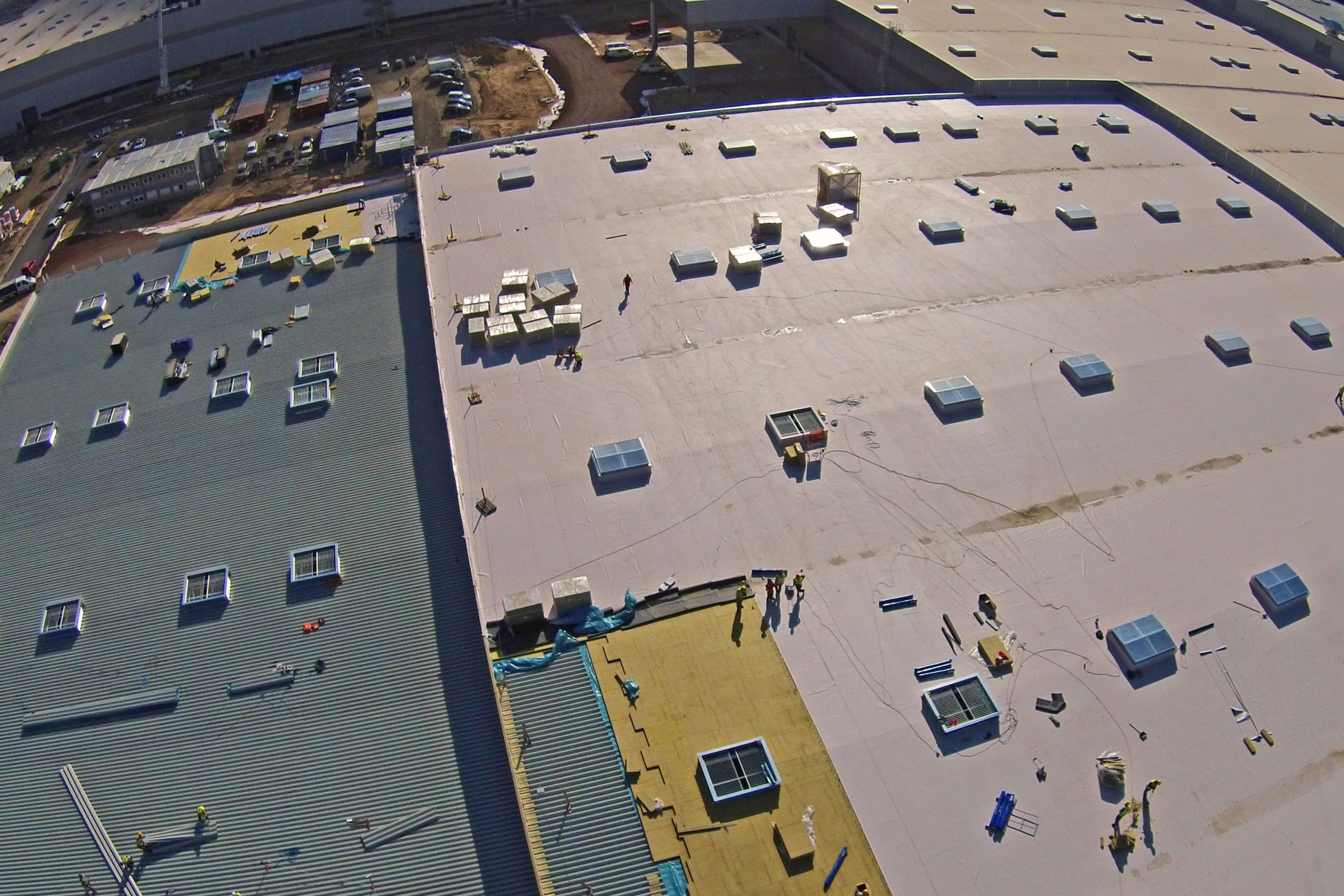 Applying Sika Sarnafil waterproofing membrane on all roofing areas on Volkswagen Plant in Wrzesnia