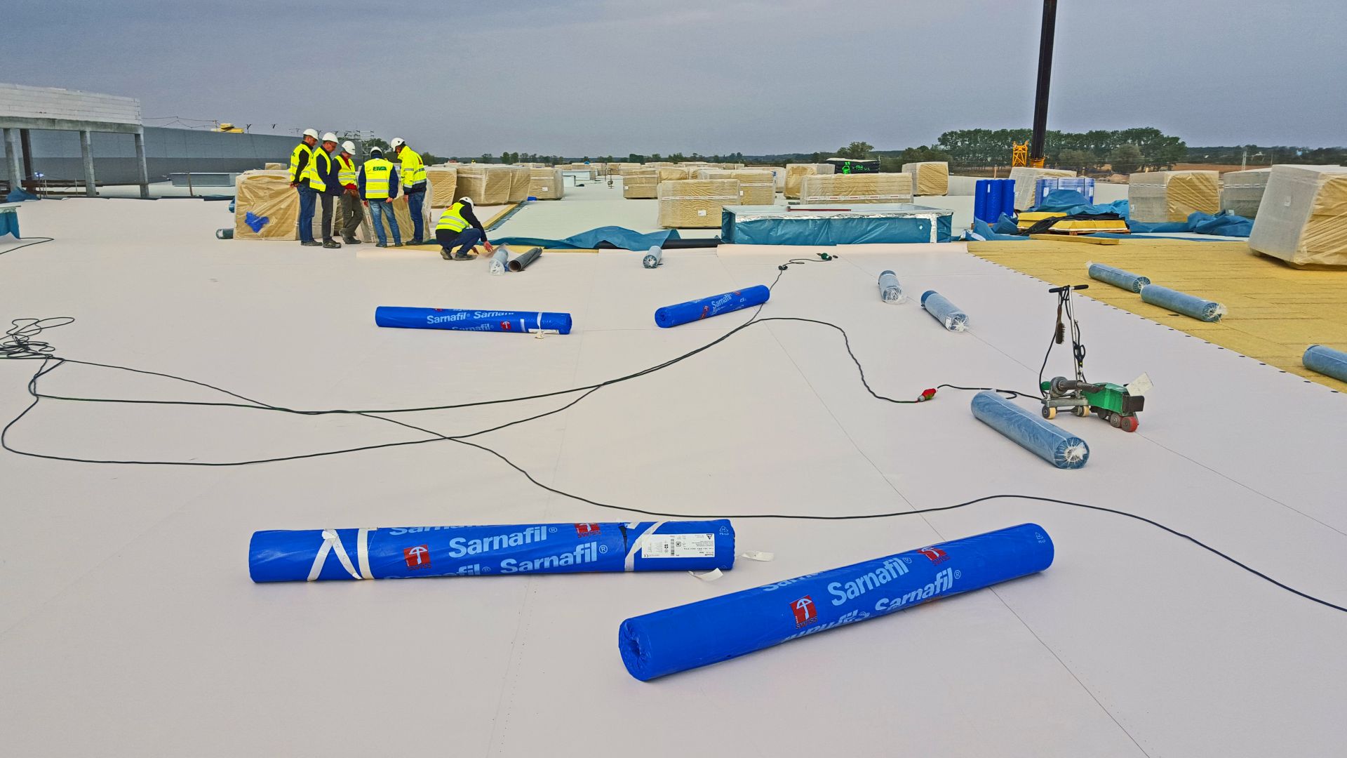 Applying Sika Sarnafil waterproofing membrane on all roofing areas on Volkswagen Plant in Wrzesnia