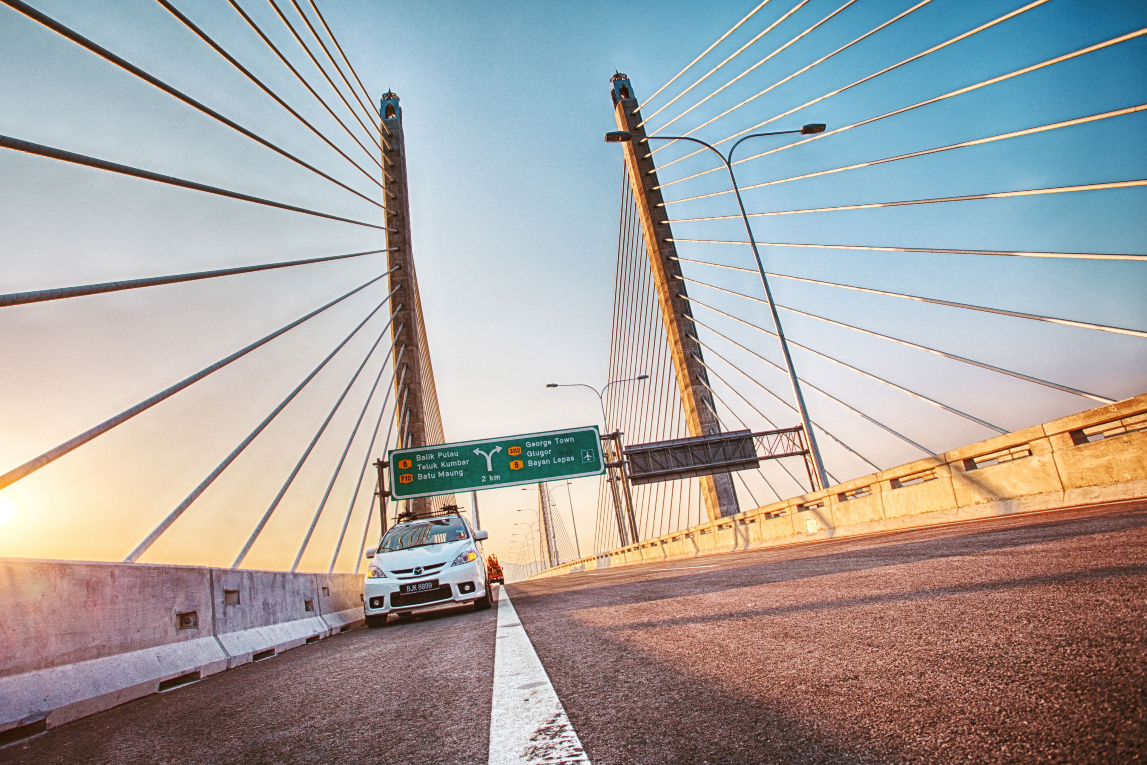 White car on Second Penang Bridge in Malaysia