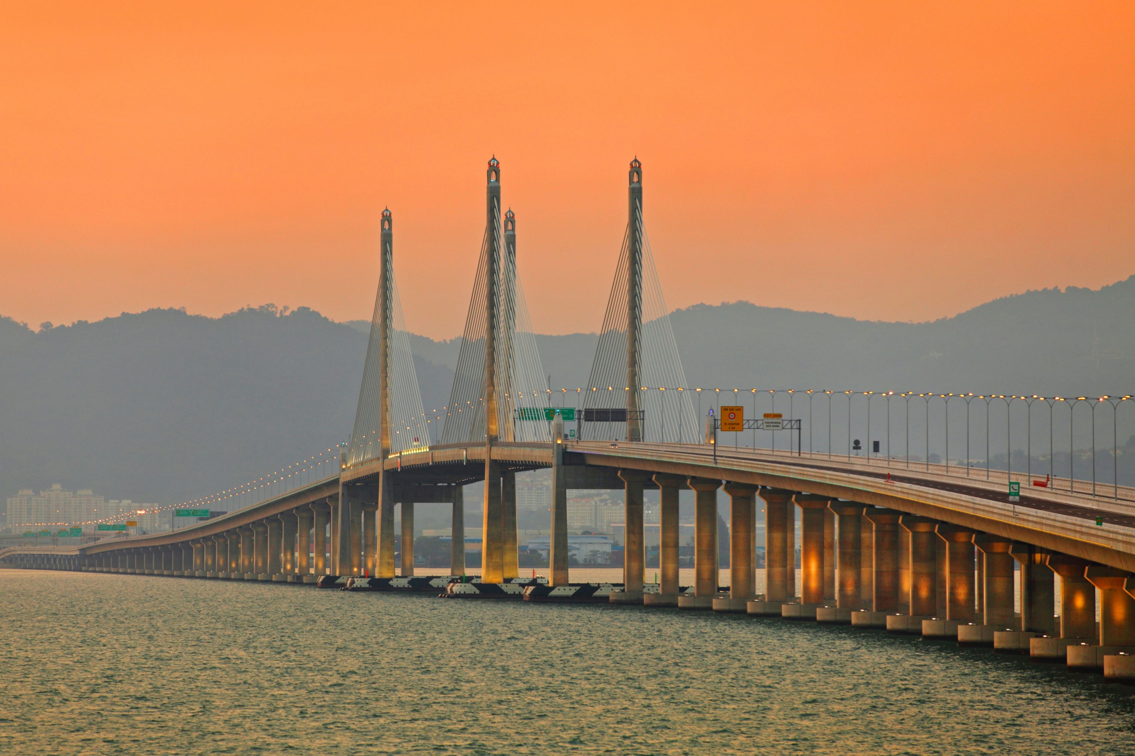 Orange sunset sky over Second Penang Bridge in Malaysia