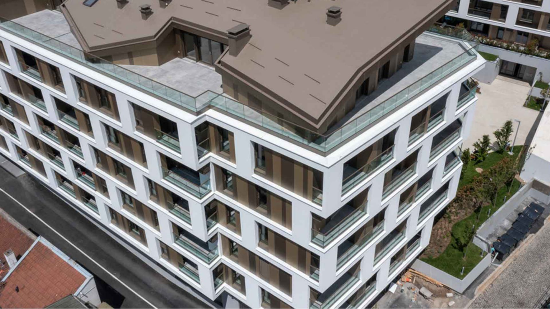 Merin Hill Condominium building in Serbia with white facade finish plaster render