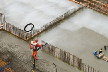 Man applying concrete on construction site with Sika® Antisol® curing compound