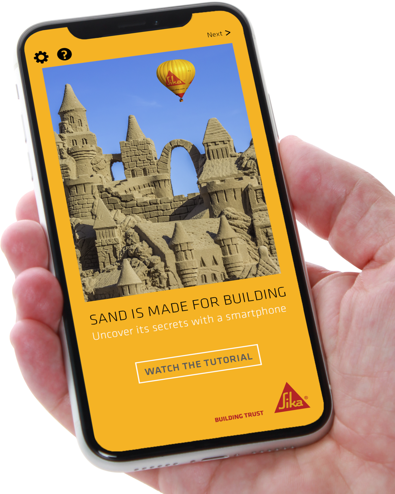 Mobile screen showing Sika concrete Sand App welcome page with sand castle and hot air balloon