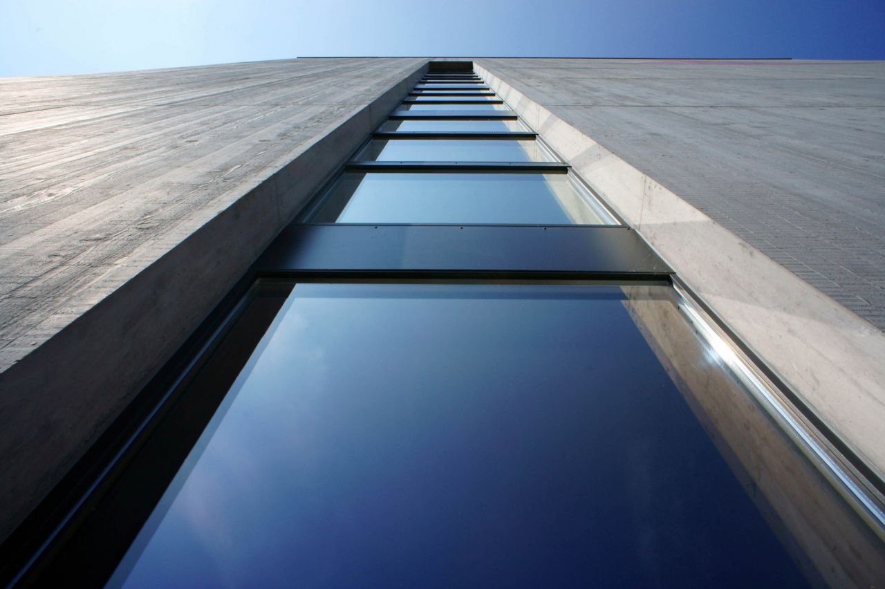 Architectural concrete facade on Sika office building with weather joint sealing glazing