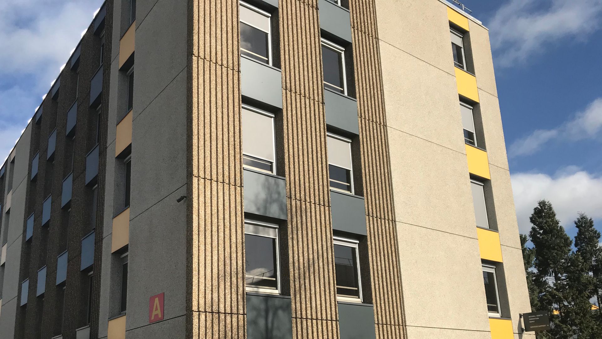 Sika® Rugasol® surface retarder applied to concrete for exposed aggregate finish on building facade