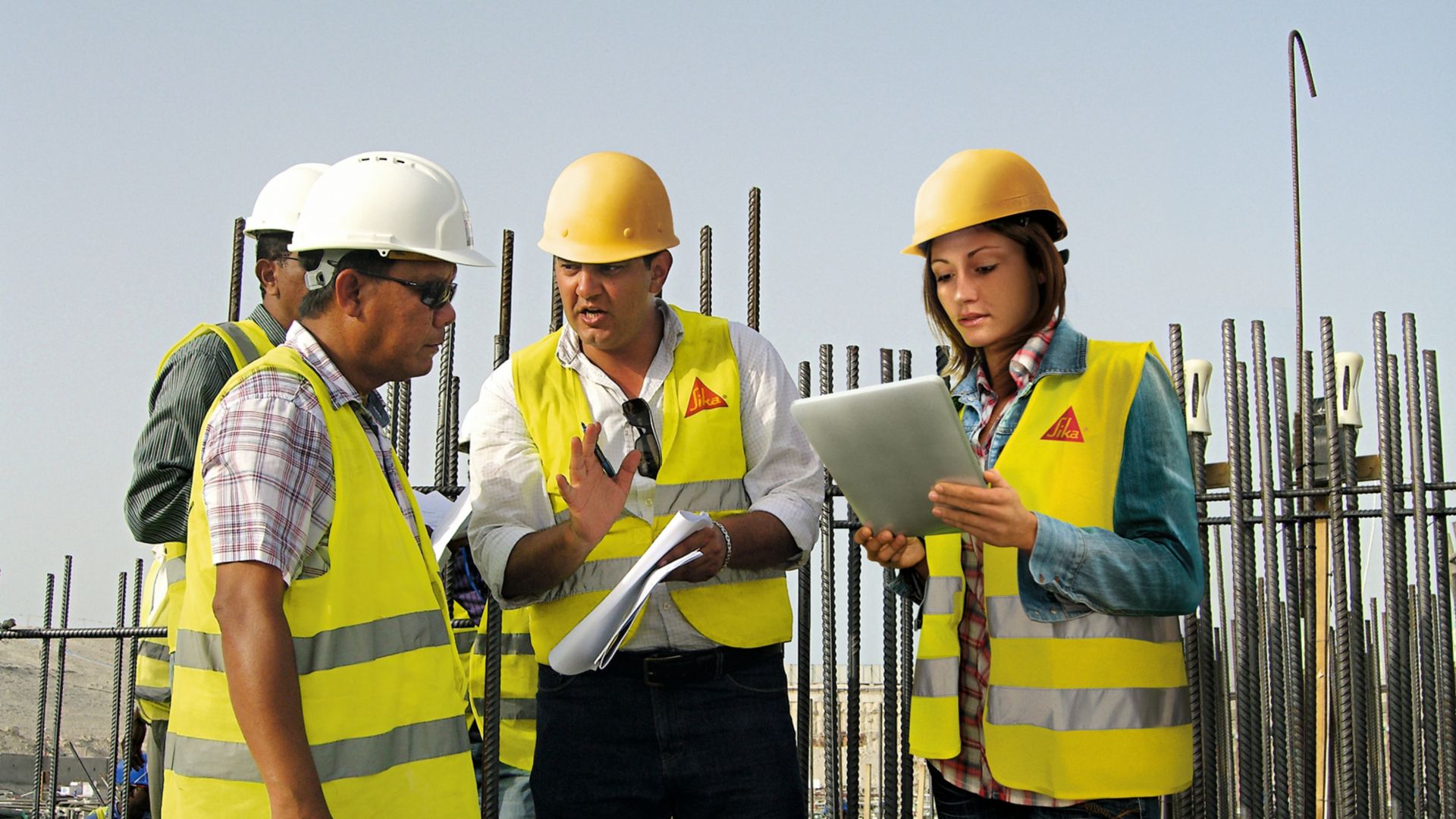 Sika technical experts advising specifier on construction site