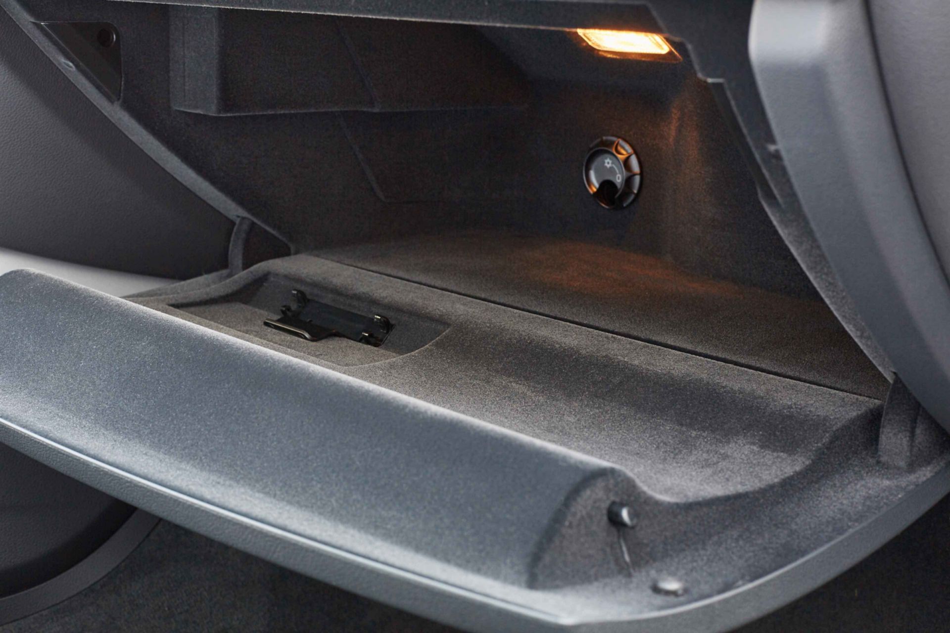 Interior view of vehicle glove box using SikaTherm flocking adhesives solution