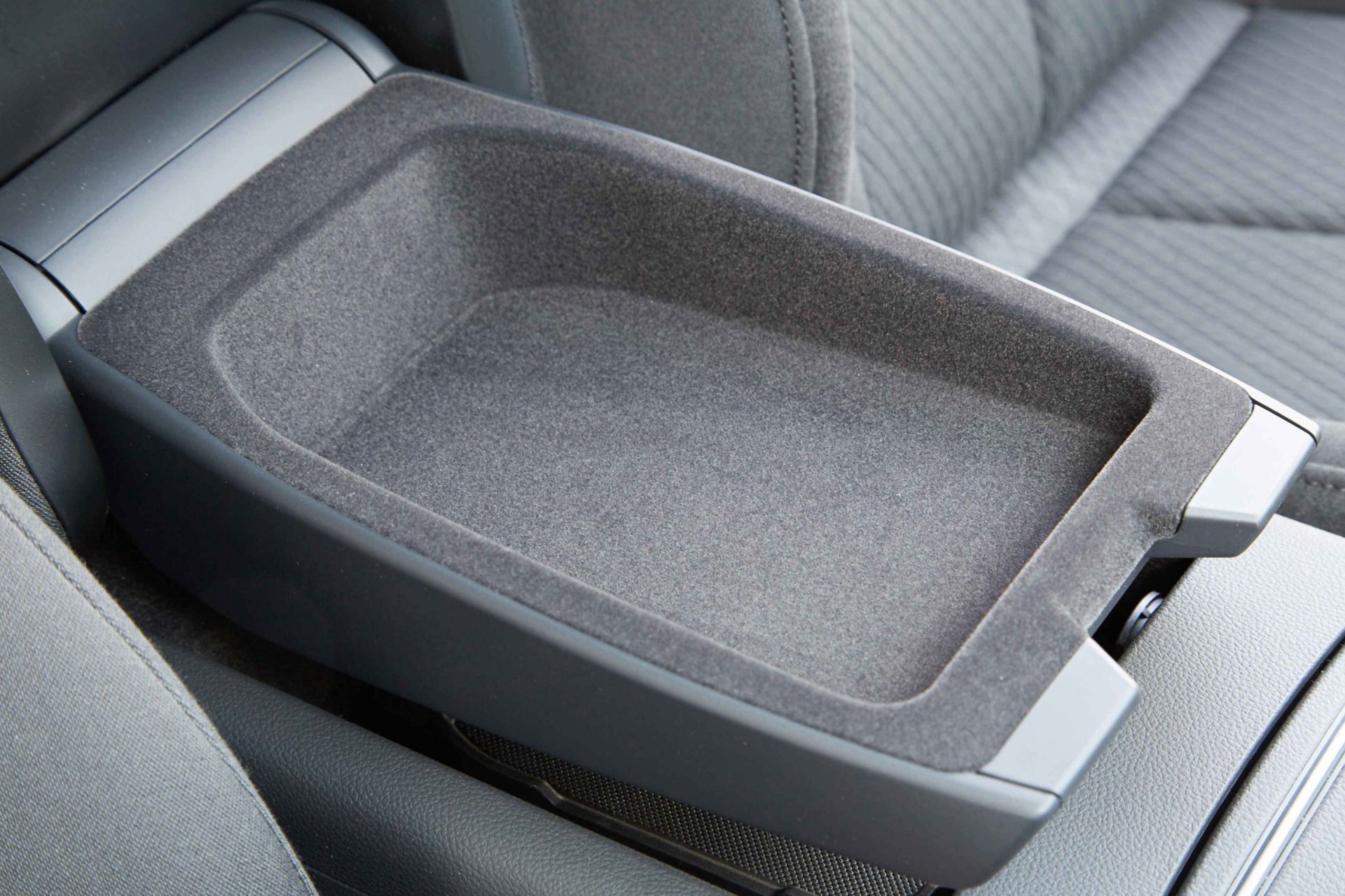 View of vehicle center console storage using Sika interior flocking adhesive solutions