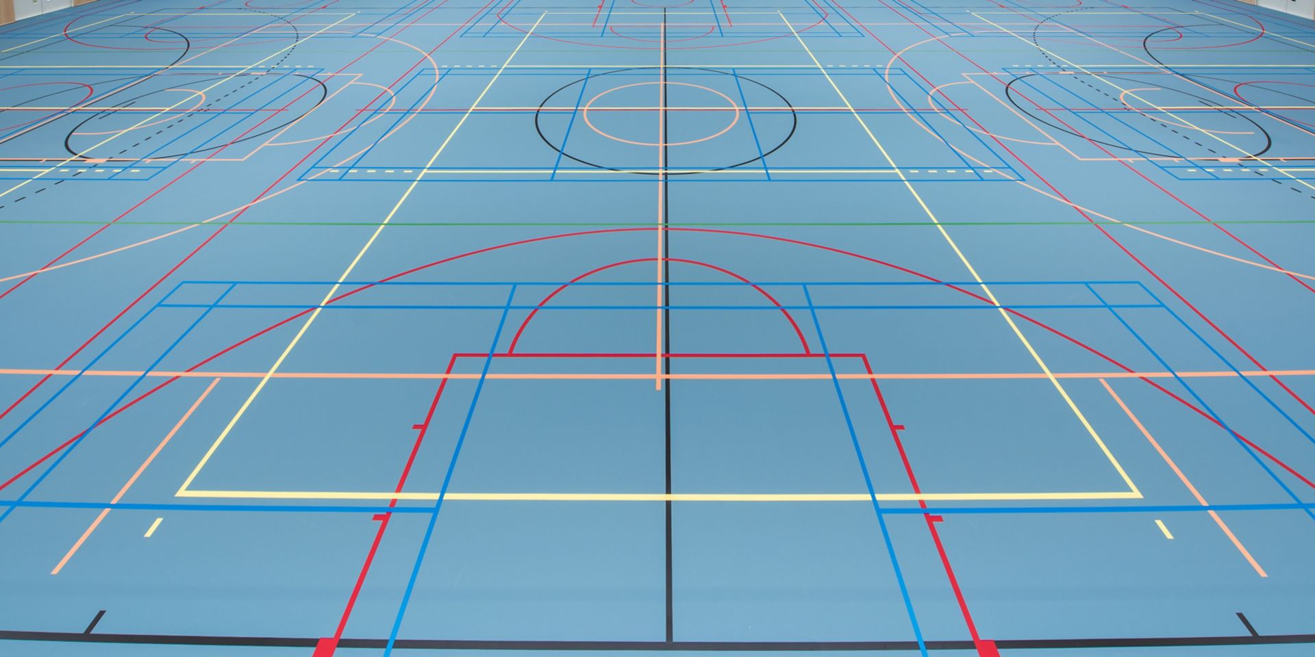 Basketball court gym blue floor with Sika Pulastic flooring at Zuiderpark Sport Center in the Netherlands